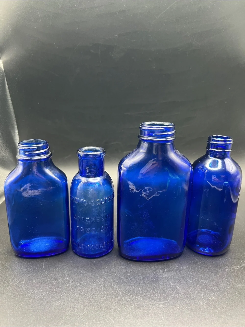 Lot of 4 vintage Colbalt Blue Glass Bottles